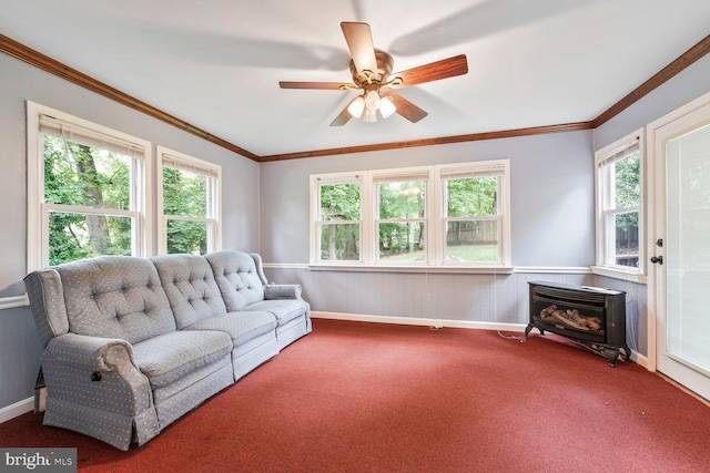 11919 Berrybrook Ter, Upper Marlboro, MD 20772 - carpeted living room with a wood stove, a ceiling fan, crown molding, wainscoting, and baseboards