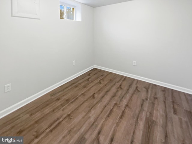 spare room featuring dark hardwood / wood-style flooring