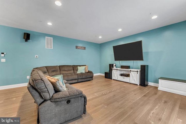 living room with light hardwood / wood-style flooring