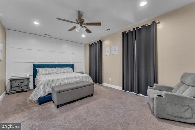 bedroom featuring light colored carpet and ceiling fan