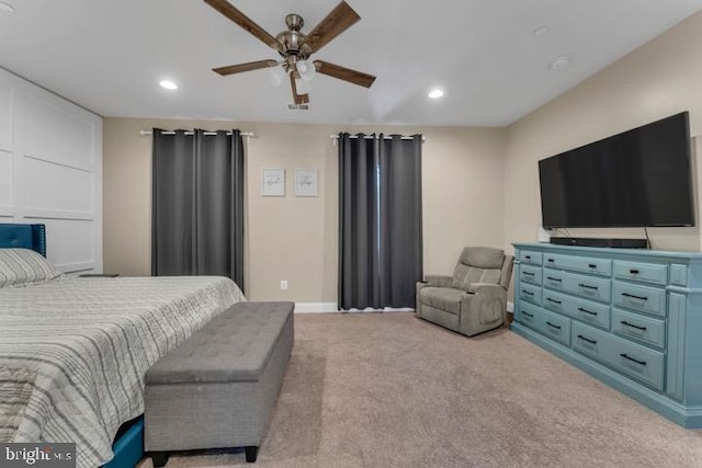 bedroom featuring ceiling fan and light carpet