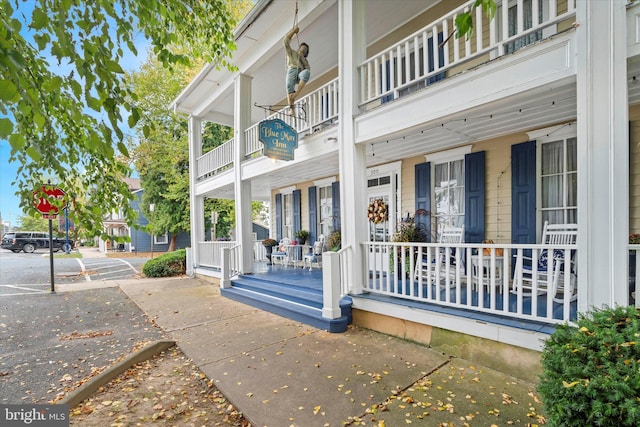 property entrance featuring covered porch