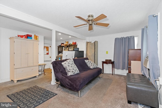 carpeted living room with ceiling fan