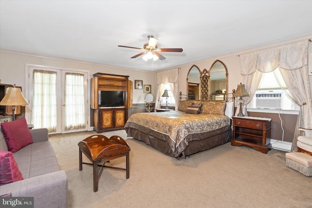 carpeted bedroom with ornamental molding, a baseboard heating unit, cooling unit, and ceiling fan