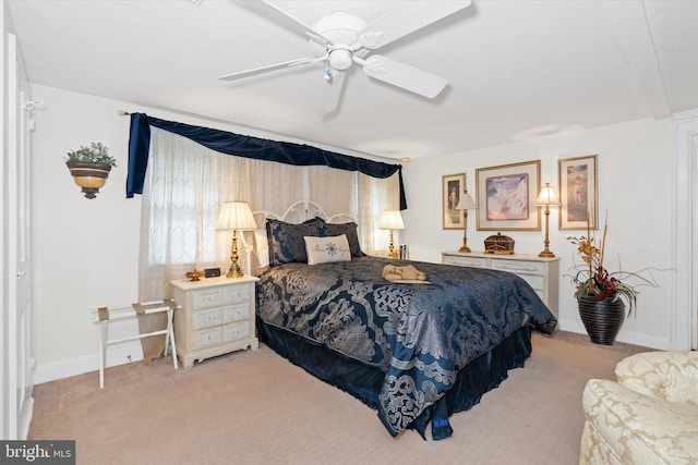 bedroom with light colored carpet and ceiling fan