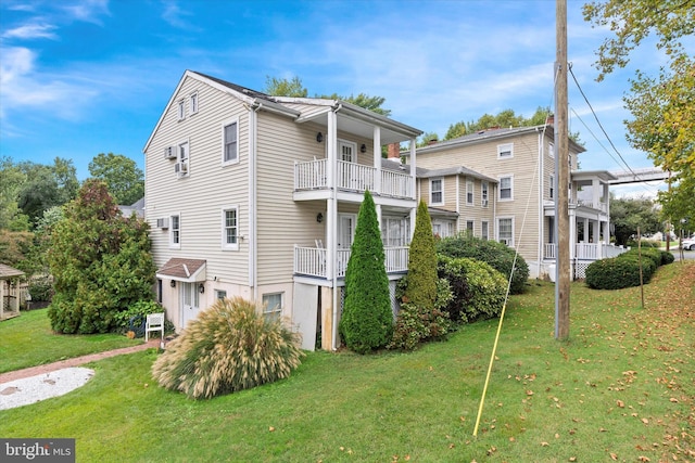 view of property exterior featuring a lawn and a balcony