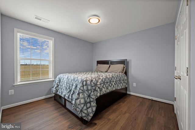 bedroom featuring dark hardwood / wood-style flooring