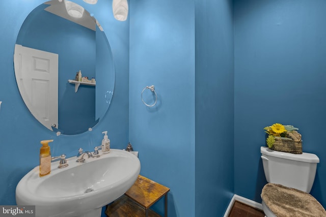 bathroom featuring sink and toilet