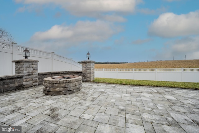 view of patio featuring an outdoor fire pit