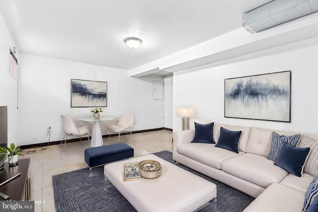 living area featuring baseboards