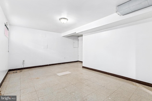 finished basement with light floors and baseboards