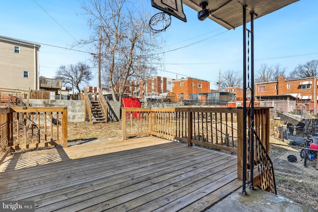 wooden terrace with fence and a residential view