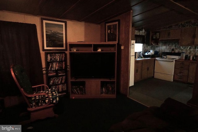 living area featuring lofted ceiling