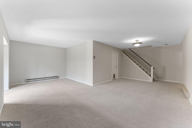 interior space with a baseboard radiator and light carpet