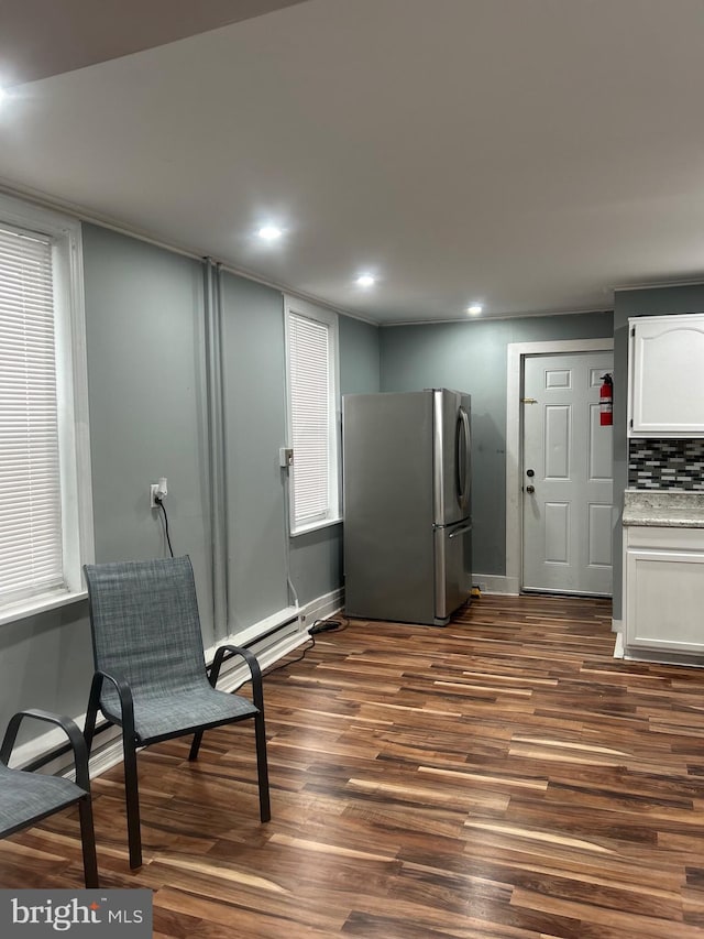 sitting room featuring dark wood-type flooring