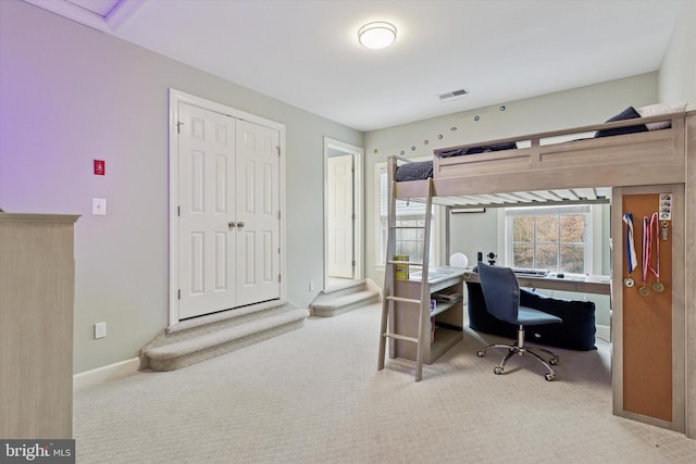 office featuring carpet, visible vents, and baseboards