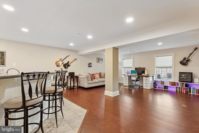 interior space featuring recessed lighting and baseboards