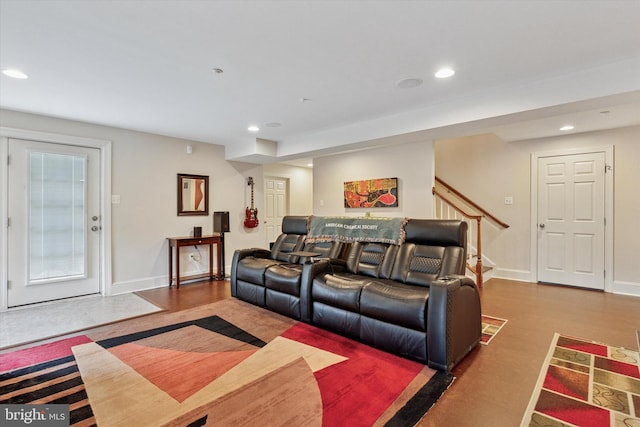 living area featuring baseboards, stairway, wood finished floors, and recessed lighting