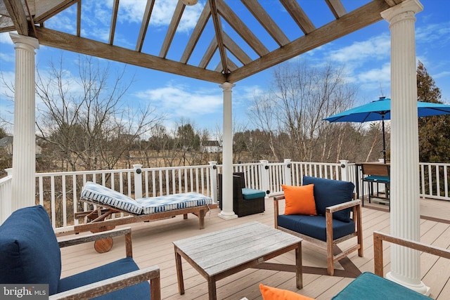 deck featuring an outdoor hangout area and a pergola