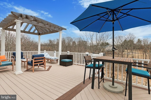 wooden deck with an outdoor hangout area