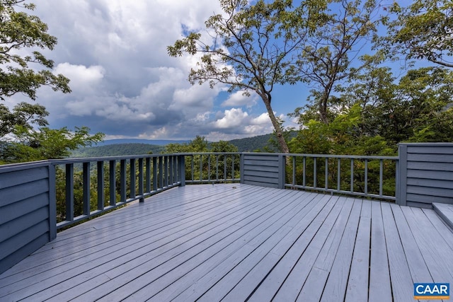 wooden terrace with a mountain view