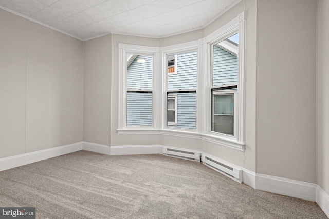 carpeted spare room featuring crown molding and a healthy amount of sunlight