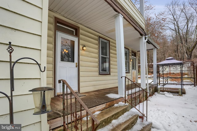 view of snow covered property entrance