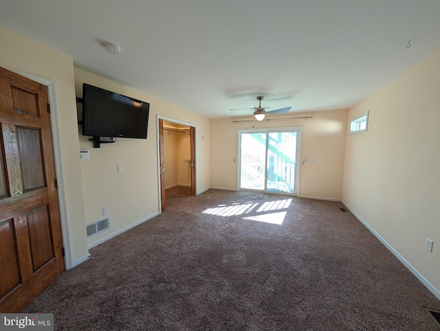 unfurnished living room with ceiling fan and carpet floors