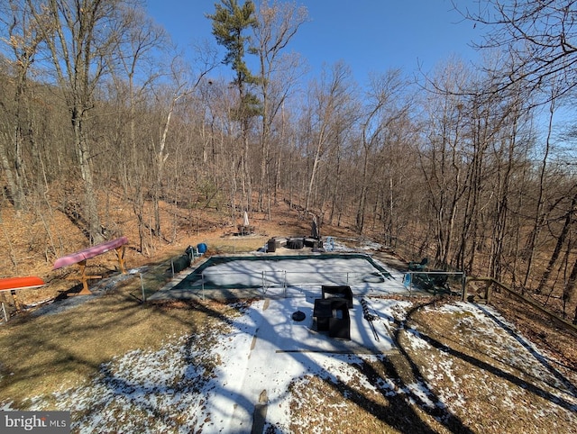 view of snow covered pool