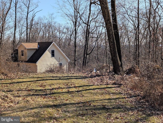 view of home's exterior featuring a yard