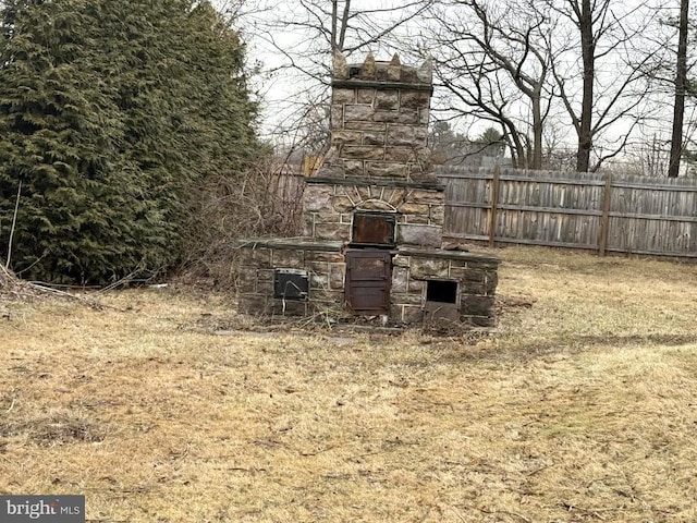 view of yard featuring a fireplace