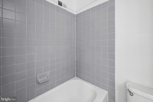 bathroom featuring toilet and visible vents