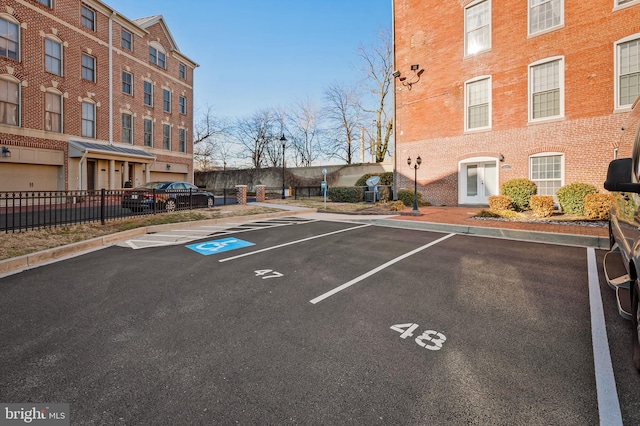 uncovered parking lot with fence