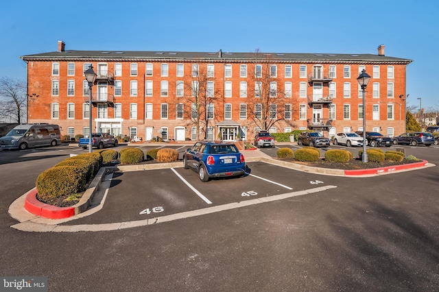 view of property with uncovered parking