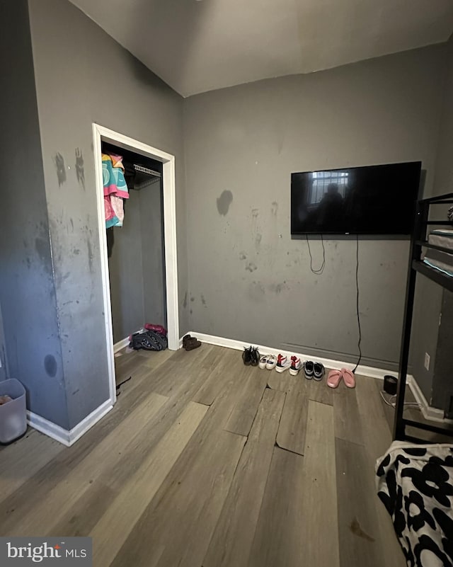 unfurnished bedroom featuring hardwood / wood-style flooring