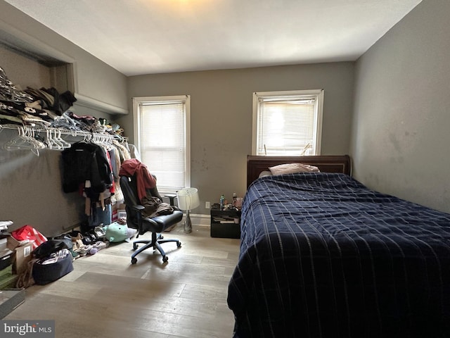 bedroom with light hardwood / wood-style floors