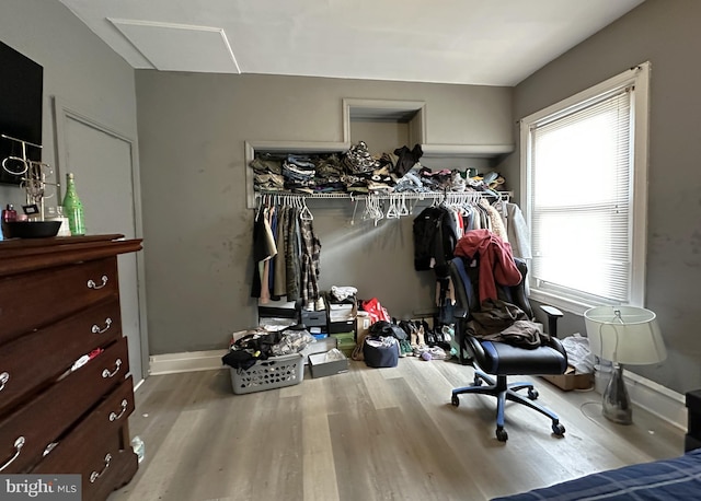 bedroom featuring hardwood / wood-style flooring and a closet