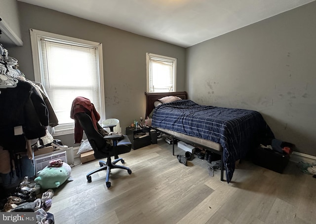 bedroom with light wood-type flooring