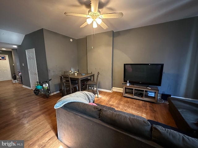 living room with hardwood / wood-style floors and ceiling fan