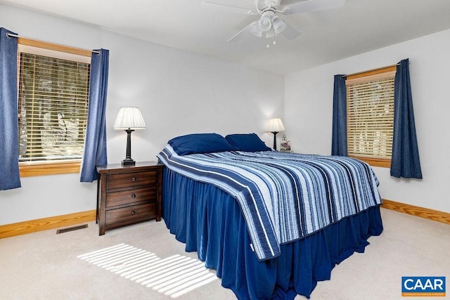 carpeted bedroom featuring ceiling fan