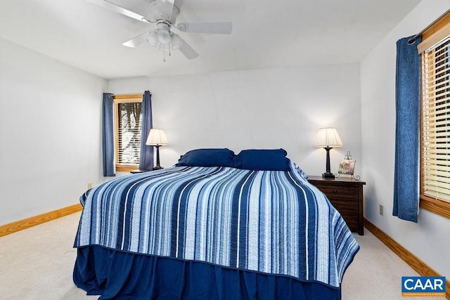 bedroom with ceiling fan and carpet flooring