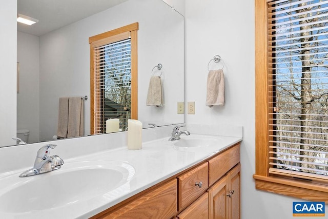 bathroom featuring vanity and toilet