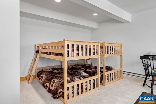 carpeted bedroom featuring a baseboard heating unit