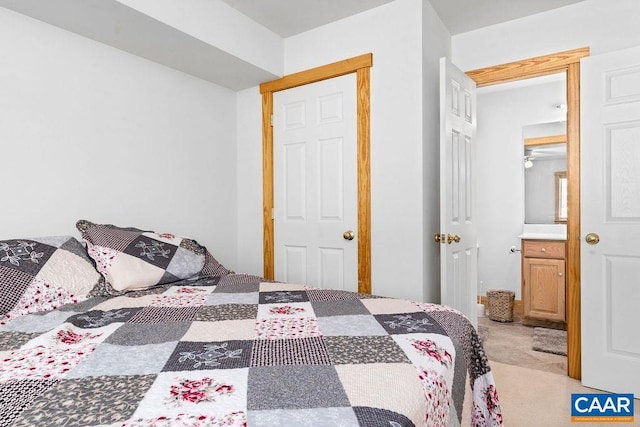 bedroom featuring light carpet