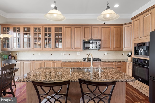 kitchen featuring dark wood finished floors, decorative backsplash, crown molding, and oven