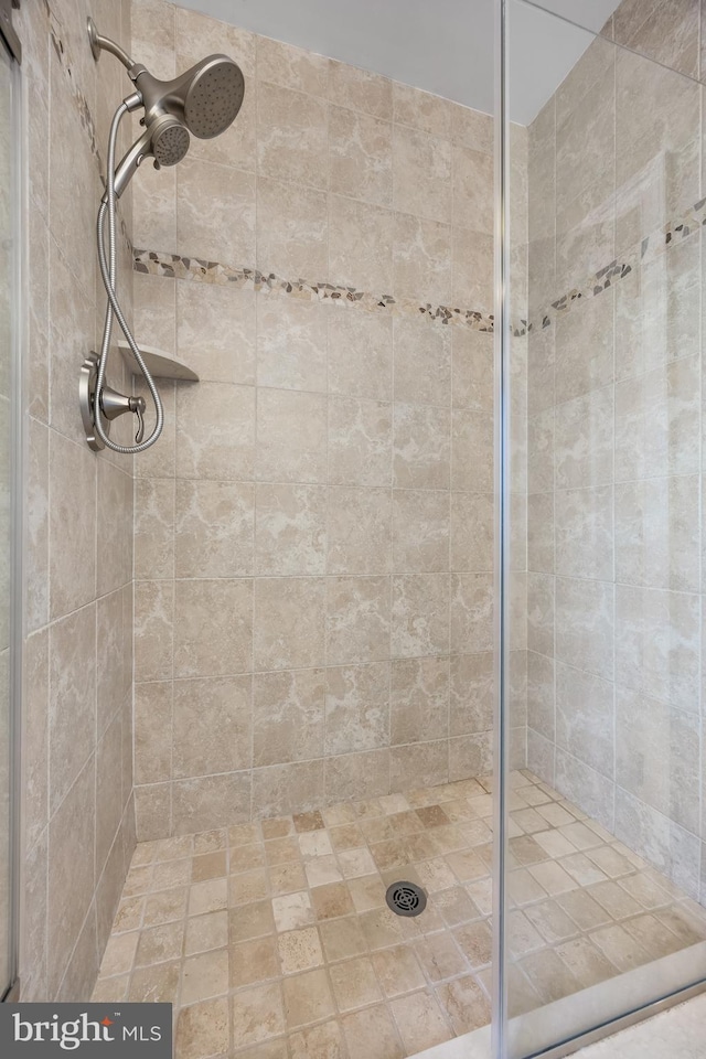 full bathroom featuring a stall shower