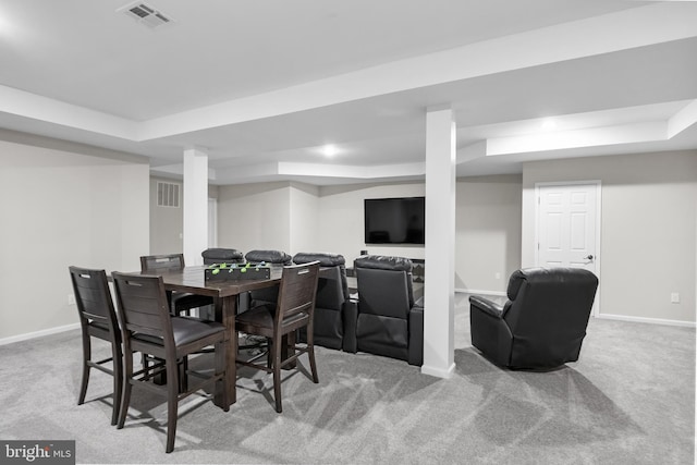 dining area featuring baseboards, a raised ceiling, visible vents, and carpet flooring