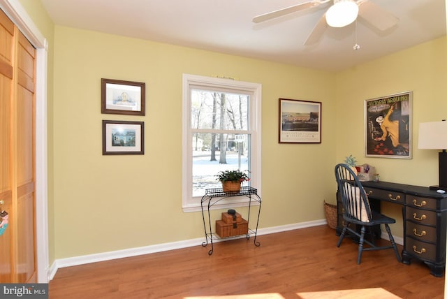 office area with ceiling fan, wood finished floors, and baseboards