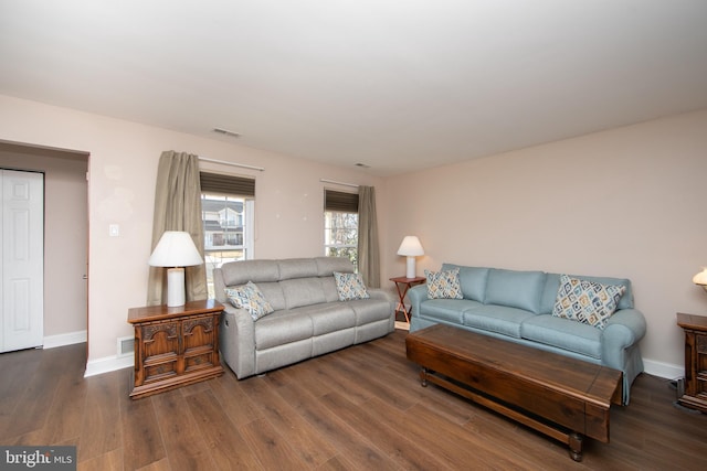 living room with dark wood-type flooring