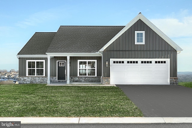 view of front of property with aphalt driveway, a garage, a shingled roof, stone siding, and board and batten siding